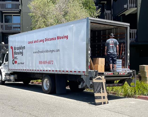 A man loading a moving truck