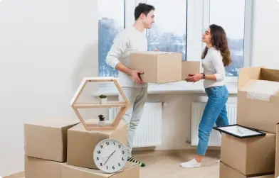 Brooklyn Moving Inc. employee handling a dolly with boxes